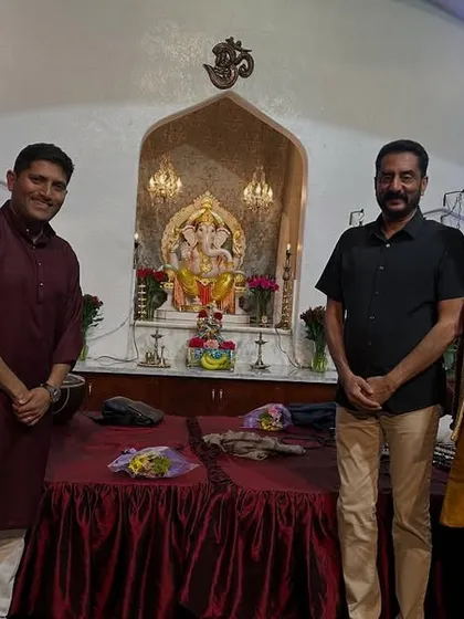 Posing with fellow musicians and organizers in front of a Ganesha shrine at one of our California venues. Music and spirituality are deeply connected.
