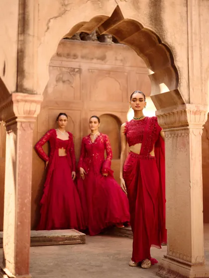 The full trio of red looks from the Awigna campaign. This showcases different silhouettes in the same powerful color, perfect for a coordinated bridal party.