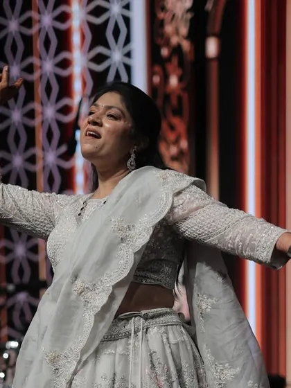 A graceful solo moment during a family member's performance. We ensure everyone gets a chance to shine.