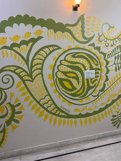 The full view of the 'Harmony' mural, stretching across the living room wall. It has completely changed the vibe of the space, making it a vibrant and happy hub for the family.