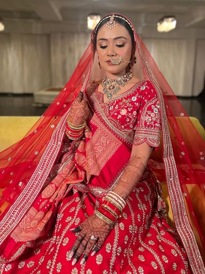 A moment of quiet contemplation. The soft golden lids and flawless base create a look that is both traditional and sophisticated.