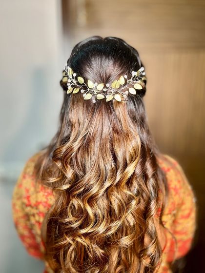 A view of the beautiful, intricate hairstyle.