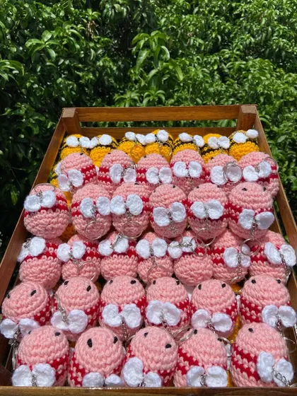 A crate of my adorable bee keychains, handmade with love. This bulk order of 90 pieces includes both classic yellow and cute pink bees.