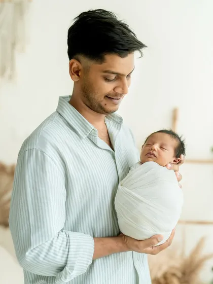 A father's gentle hold, a lifetime of love. These are the simple, profound family moments I cherish capturing during every newborn session.