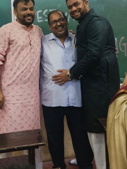 A candid moment of camaraderie between our male faculty members during the Diwali party.