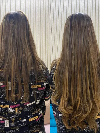 The final result of a keratin glue extension service. The extensions are blended so well that they are indistinguishable from the client's natural hair, just longer and fuller.