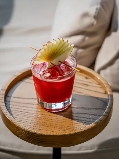 This shot of a vibrant red cocktail demonstrates my skill in beverage photography. I use light and shadow to create a moody, sophisticated feel that makes the drink the hero, perfect for a bar's menu or social media.