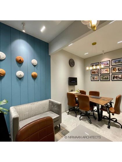 The conference area in our studio, with a gallery wall of our completed projects. This space is where we share our work and begin the journey of designing a new home with our clients.