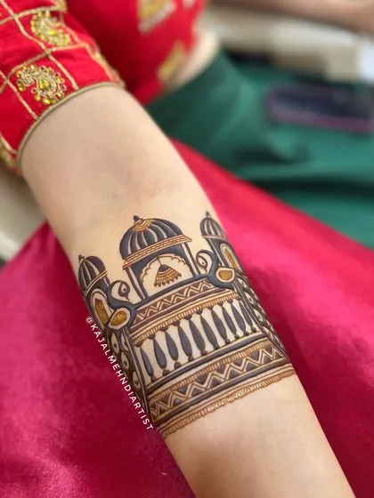 Another view of the beautiful palace and peacock arm cuff, a perfect blend of architectural and natural elements.