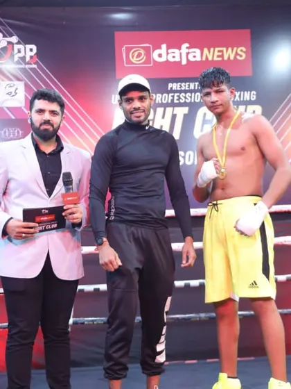 A young pro fighter being recognized for his performance. We provide a stage for upcoming talent to shine.