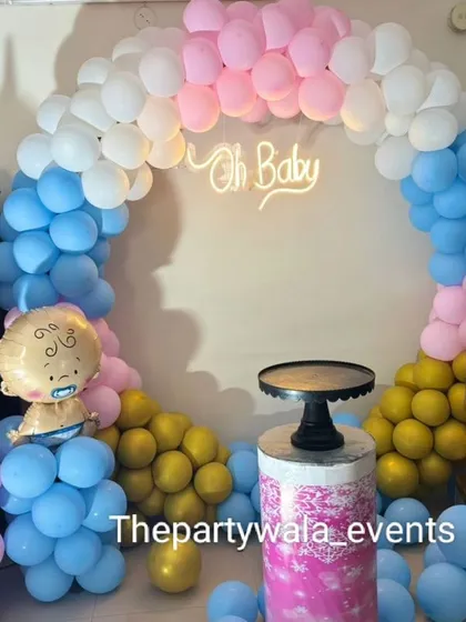 Another take on the gender reveal theme, with pink, blue, and yellow balloons. The baby foil balloons and "BABY" blocks are always a cute addition.