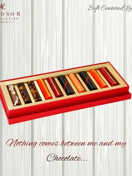 My soft-centered long bars offer a unique and modern take on the classic chocolate box. This vibrant red package contains a colorful assortment of bars with different fillings, perfect for New Year or holiday gifting.