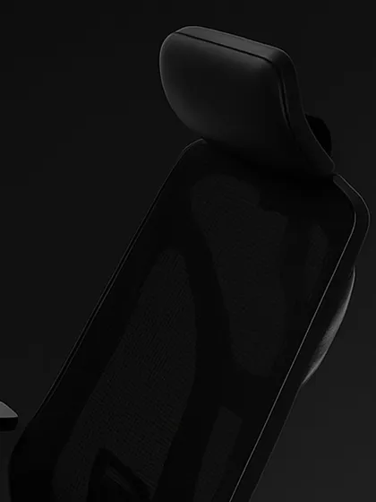 A detailed look at the breathable mesh back and adjustable headrest. This design allows for air circulation to keep you cool while providing essential support for your neck and upper back.