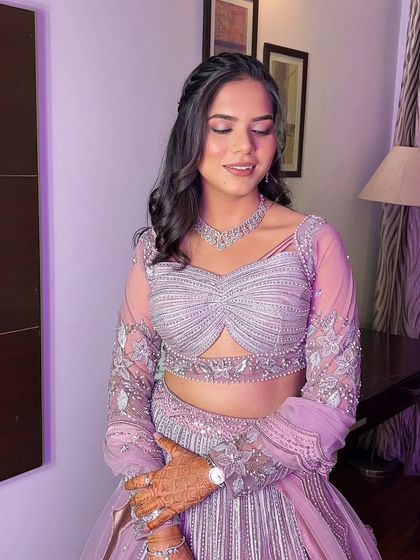 Anu wanted a subtle, glowy look for her engagement, and this is what we created. The soft pink tones on her eyes and cheeks perfectly match her beautiful lavender lehenga.