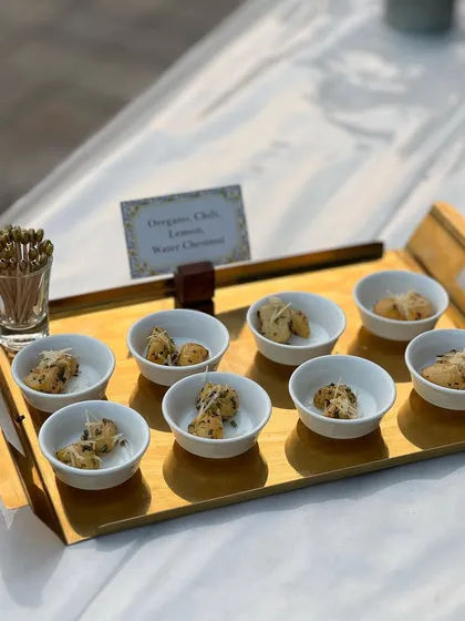 Bite-sized portions of Oregano Chili Lemon Water Chestnuts. This dish offers a contemporary twist on a classic ingredient, with a burst of robust flavours.