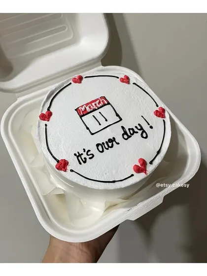 A sweet anniversary bento cake with a calendar marking 'March 11' and the message 'it's our day!'.