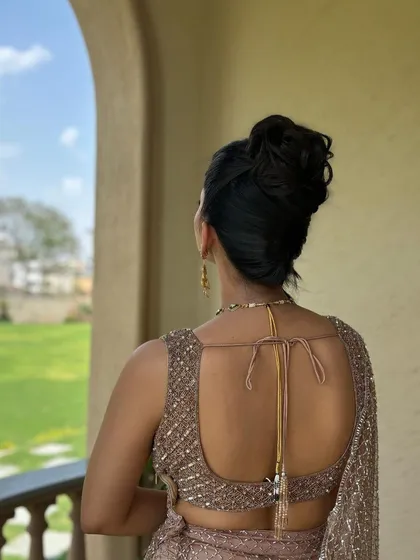 The back view of the high, textured bun. It's a clean and polished style that still has a lot of interesting detail and texture.