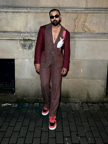 Arshad Ahmed in our Phantasm Suit, an ode to modern sophistication in rich maroon linen.
