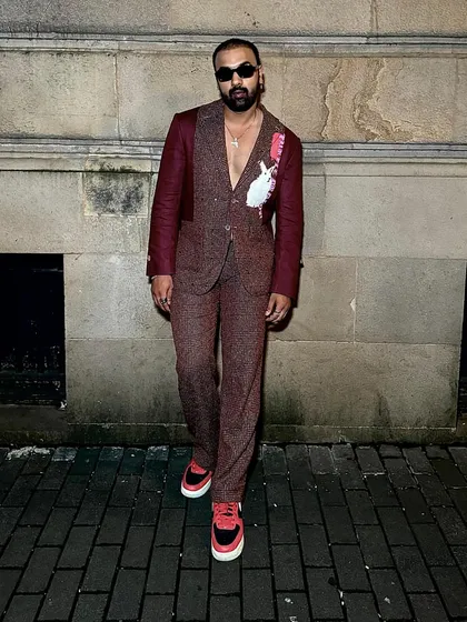 Arshad Ahmed in our Phantasm Suit, an ode to modern sophistication in rich maroon linen.