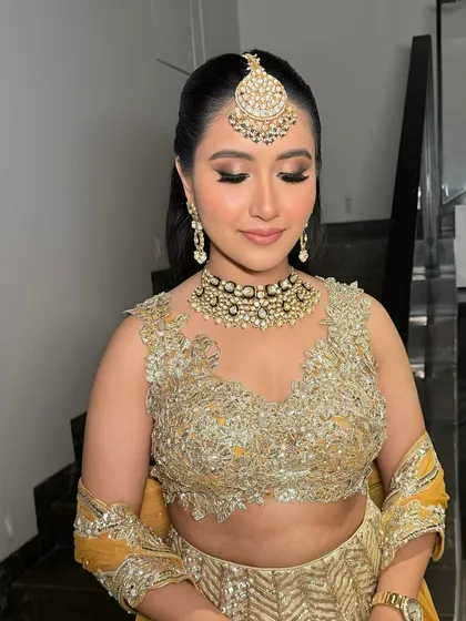 Smokey eyes paired with soft pink lips. The result is simply stunning on the beautiful Garima for her pre-wedding function.