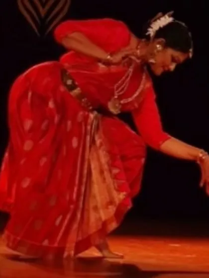 A graceful pose from my recital in Chennai. The traditional red costume and temple jewelry are an integral part of the visual aesthetic of a classical Bharatanatyam performance.