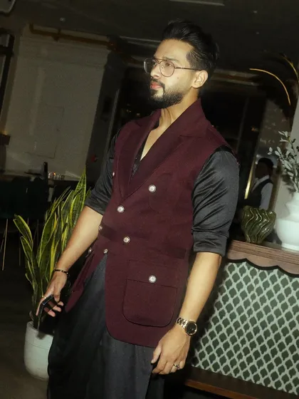 The client looking confident and stylish in his custom Indo-Western outfit, perfect for any grand celebration.