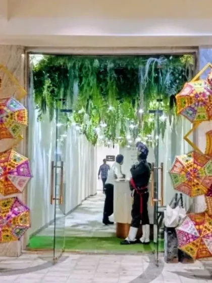 A festive and colorful entrance designed for a Navratri celebration. We used an array of traditional embroidered umbrellas to create a welcoming arch, setting a vibrant tone for the event right from the lobby.