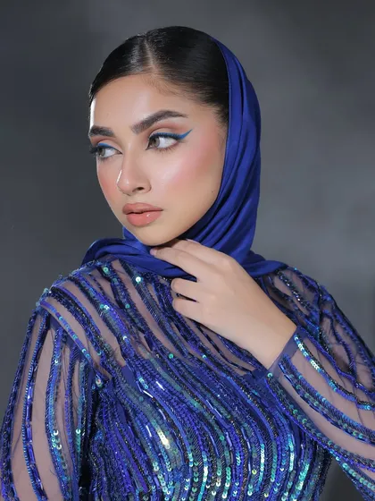 Electric vibe. This look features a sharp, crisp electric blue winged liner that is both modern and incredibly chic, especially when paired with a matching outfit.