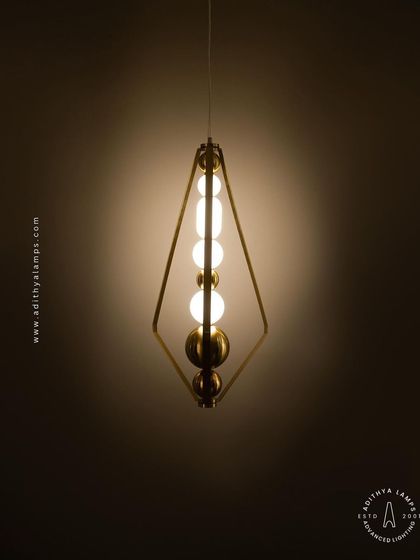 Another angle of the triangular pendant, showcasing its slender profile and the delicate balance of its components. This piece adds a touch of modern elegance without overwhelming the space.