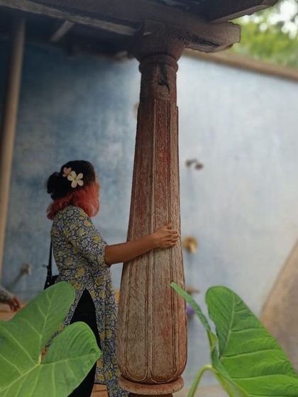 A team member connecting with the materials of one of our old projects. Revisiting our work helps us understand the tactile quality and longevity of the buildings.