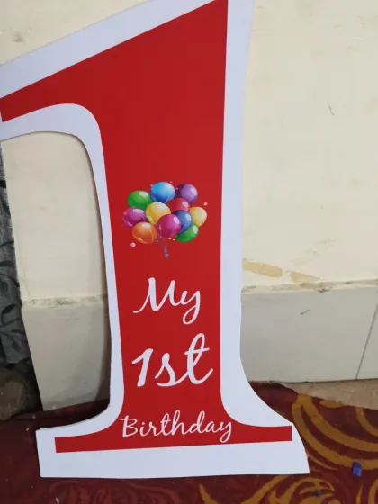 We create custom cutouts like this 'My 1st Birthday' sign to make the day extra special.