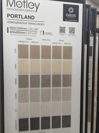 Our 'Portland' series display, showing the variety of neutral tones and finishes available. These homogeneous tiles are perfect for creating minimalist and modern spaces.