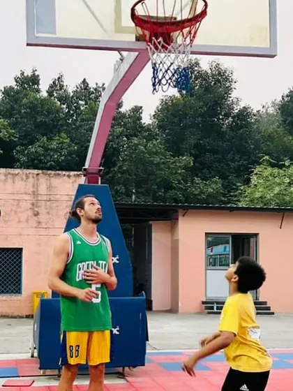 A young player learning shooting form from a professional French coach. We are committed to providing our students with world-class training opportunities.