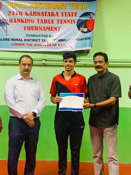 Aakash KJ being awarded the U19 Boys Champion certificate at the MSR State Ranking Tournament.