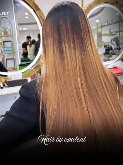 A stunning balayage that blends seamlessly from dark roots to light, golden ends. This is how I create natural-looking, high-impact hair color that turns heads.