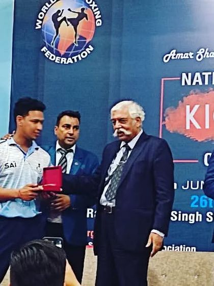 A proud moment being recognized at the National Kickboxing Championship alongside Major General G. D. Bakshi. My experience is rooted in real competition and achievement.