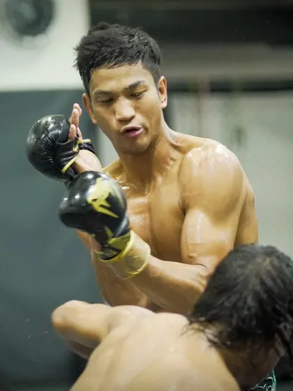 A fighter lands a clean shot during sparring. Our training focuses on technical precision, teaching fighters to be effective and efficient with their striking.