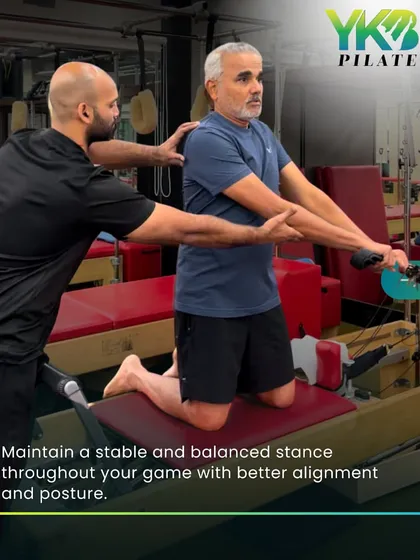 A trainer provides hands-on assistance to an older client on the reformer. This personalized guidance ensures proper form, maximizes benefits, and maintains stability throughout the workout.