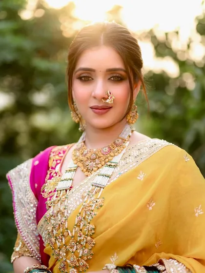 Poise, pride, and heritage. For this bride's look, I created a soft smokey eye and a neutral lip to balance the bright yellow and pink of her saree, letting her natural beauty and the intricate jewelry shine.