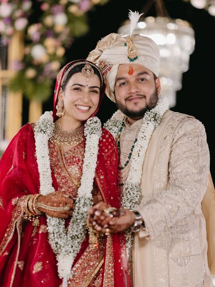 A beautiful moment from the Varmala ceremony. The bride's makeup is soft and radiant, designed to look stunning in person and in photographs.