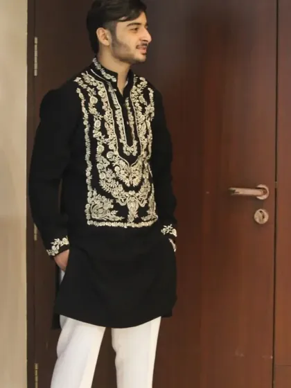 The full look of the black and gold embroidered kurta.