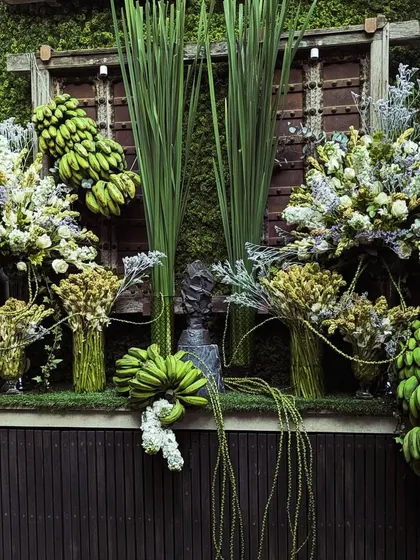 This is my modern take on ethnic design. I used fragrant tuberoses, mogra, and interesting foliage, adding an unexpected twist with bunches of green bananas for a truly unique and artistic installation.