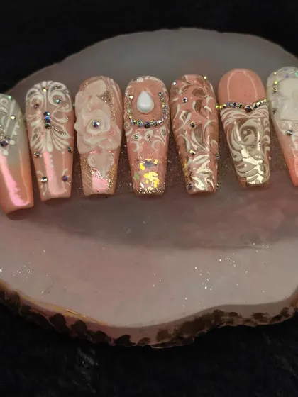 Our advanced courses empower you to create true works of art. This intricate, royal-inspired set features detailed 3D floral work, delicate freehand patterns, and perfectly placed rhinestones, showcasing the high-level skills you can learn with us.