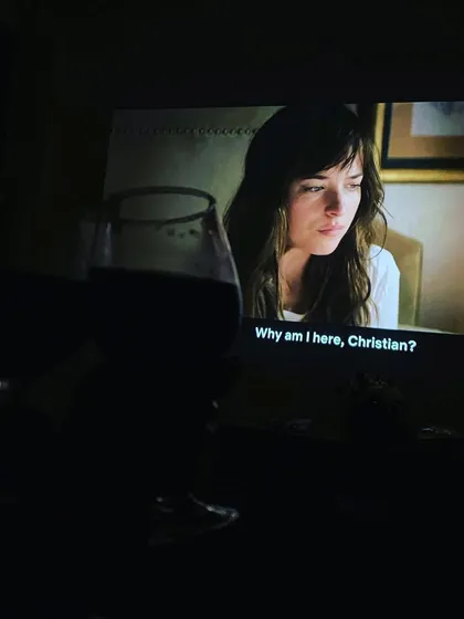 A glass of wine and a classic like 'Fifty Shades of Grey' on the big screen makes for a perfect night in.