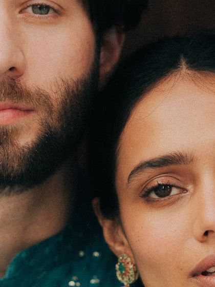 An extreme close-up, focusing on the eyes and the subtle connection between the couple. This artistic, moody shot is about feeling, not just seeing. It’s a raw and intimate glimpse into their bond.