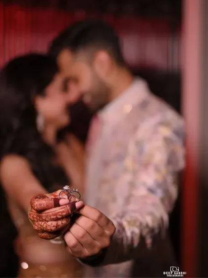The ring is a symbol of your promise. We create artistic close-ups that focus on this detail, with the couple blurred softly in the background, telling a story of commitment and love.