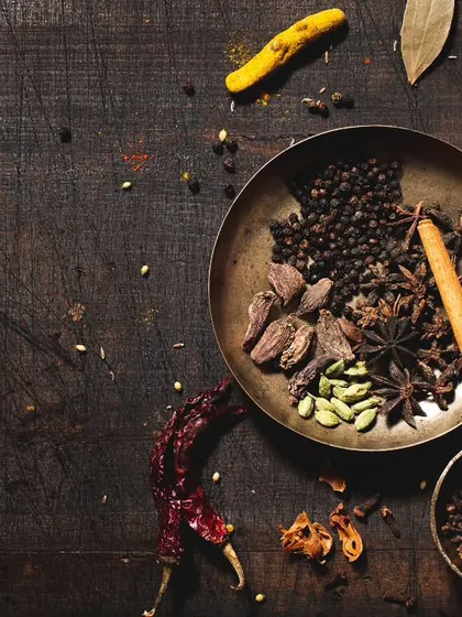 This is where the magic begins. A single plate of whole Indian spices, including fragrant cinnamon, star anise, and cardamom, captured in a dark and moody style. I used a single light source to create these deep shadows and rich textures, telling a story of flavor and tradition. This is the kind of conceptual food photography I love creating.