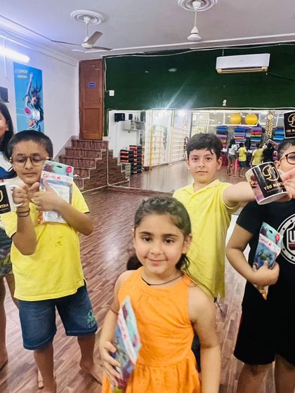 A close-up of the kids with their prizes. The smiles on their faces say everything. It’s important to me that they feel a sense of accomplishment.