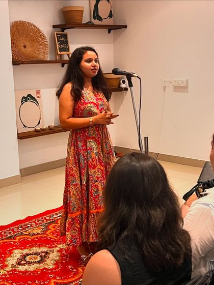 A performer sharing her story with our tribe. Our open mics are more than just events; they are a support system where artists can be vulnerable and feel heard.