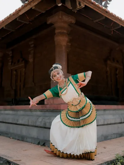 A duplicate of image 62, this shot captures a dancer in mid-pose, showcasing the dynamic movement and expressive nature of Mohiniyattam.